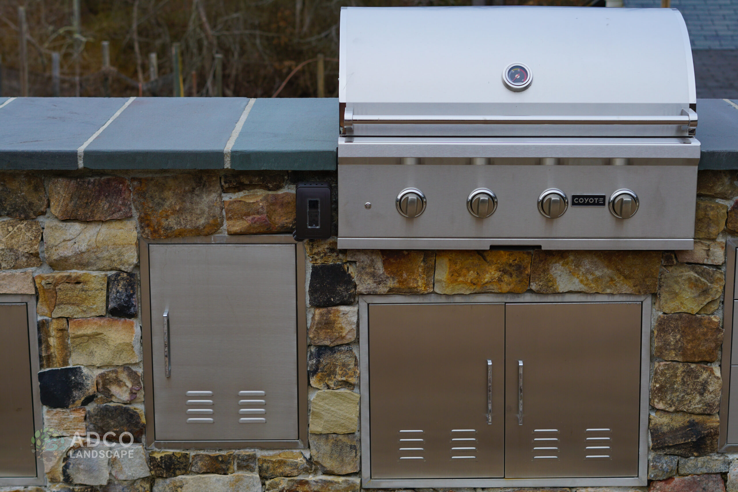 One grill on a custom stone wall.